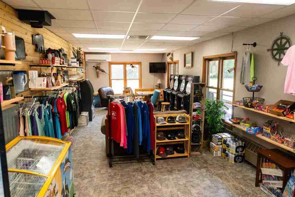 Camp store interior stocked with apparel, snacks, and supplies at Heaven’s Up North Campground