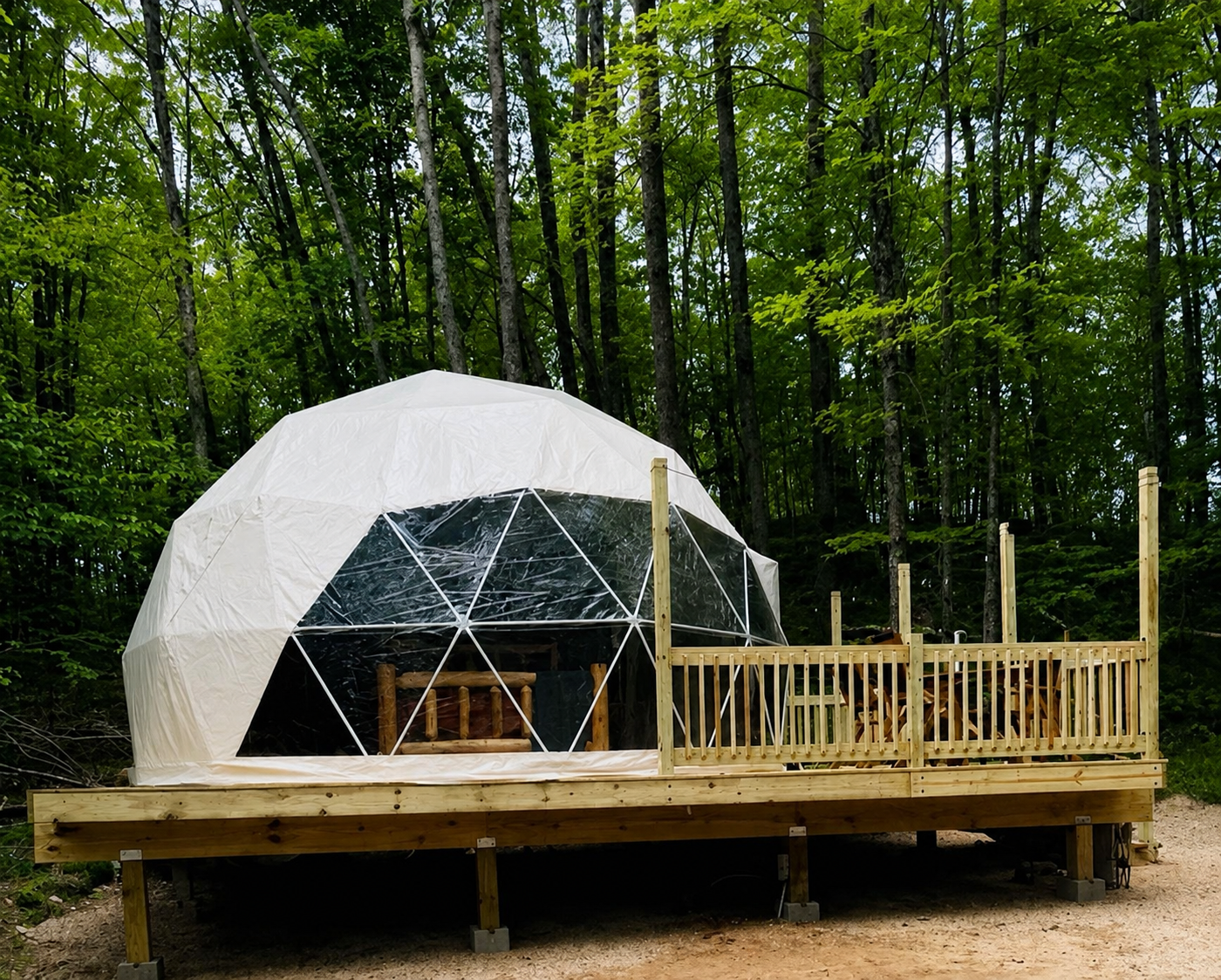 The furnished glamping dome and its wooden deck