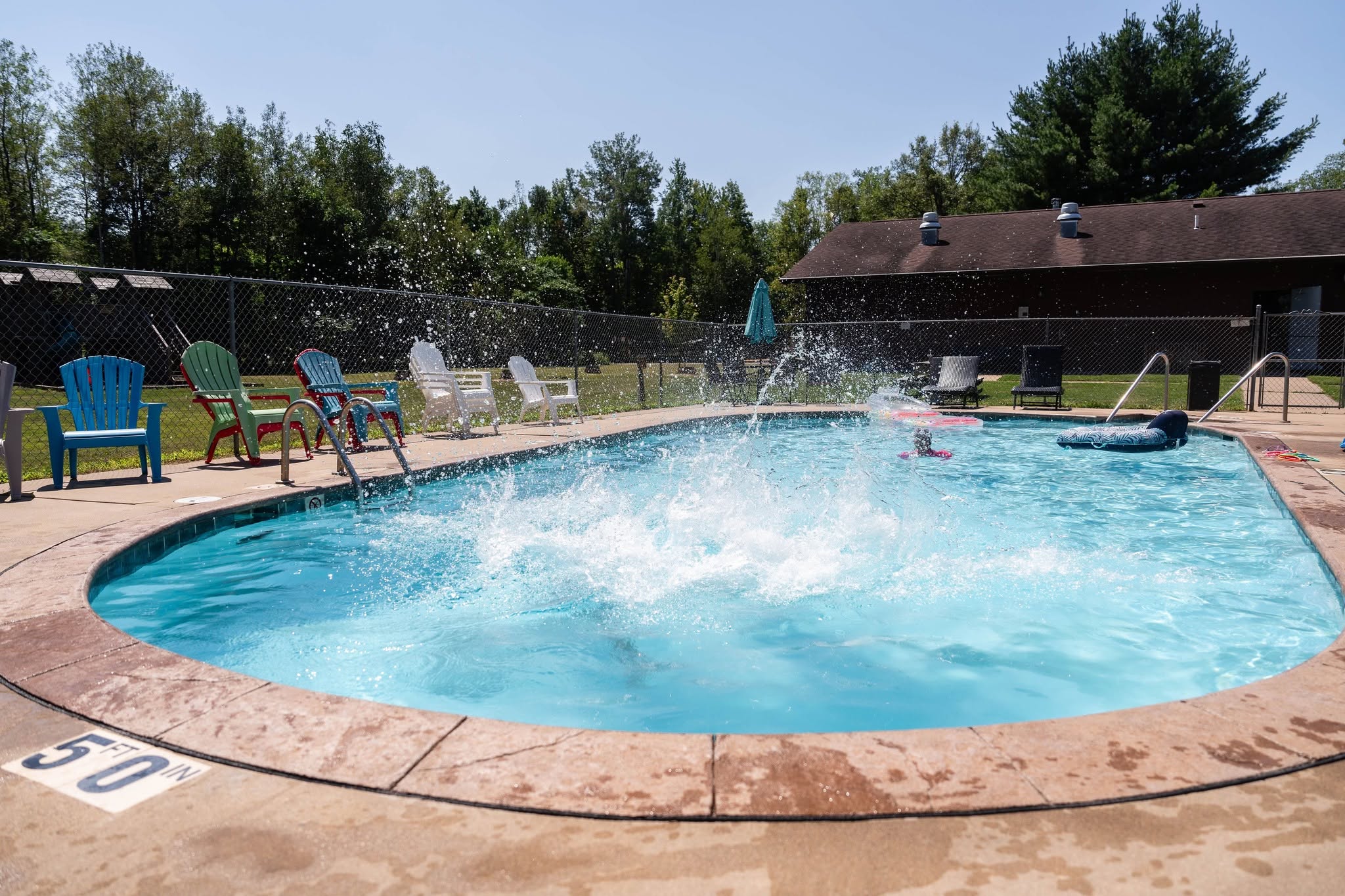 Guests enjoying the heated pool at Heaven’s Up North